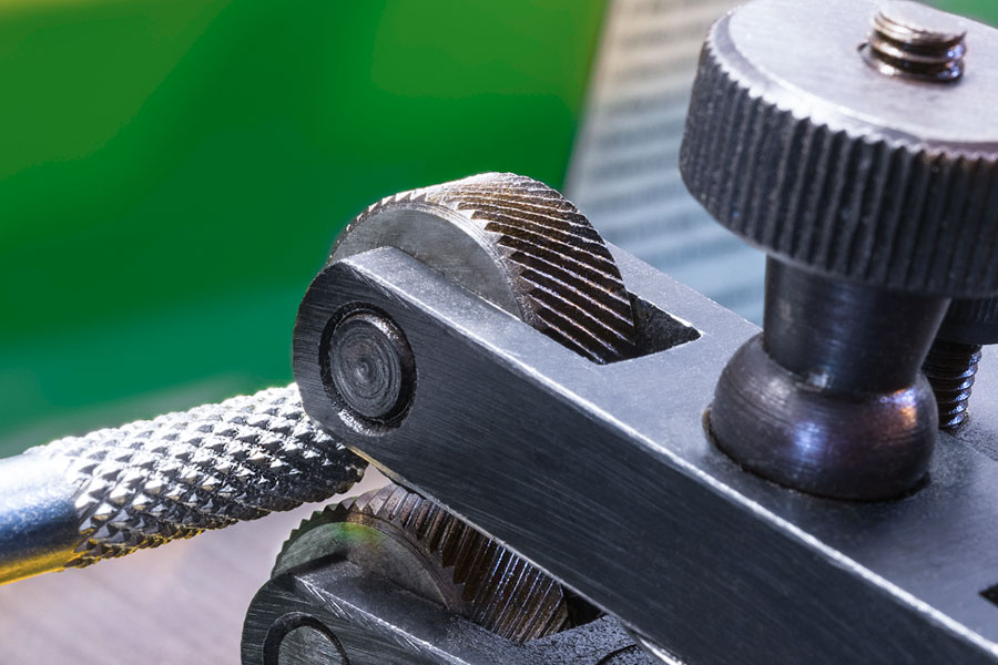 What is knurling in a mechanical sense?
