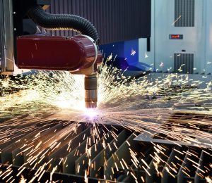 Laser or plasma cutting metalwork. Technology of flat sheet metal steel material processing with sparks